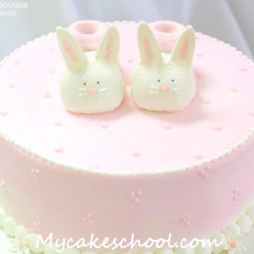Free Cake Tutorial! Adorable Bunny Baby Booties Cake Topper, perfect for baby shower cakes!