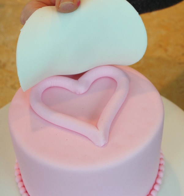 Beautiful Raised Heart Cake Tutorial! Perfect for Valentine's Day! Free tutorial by MyCakeSchool.com.