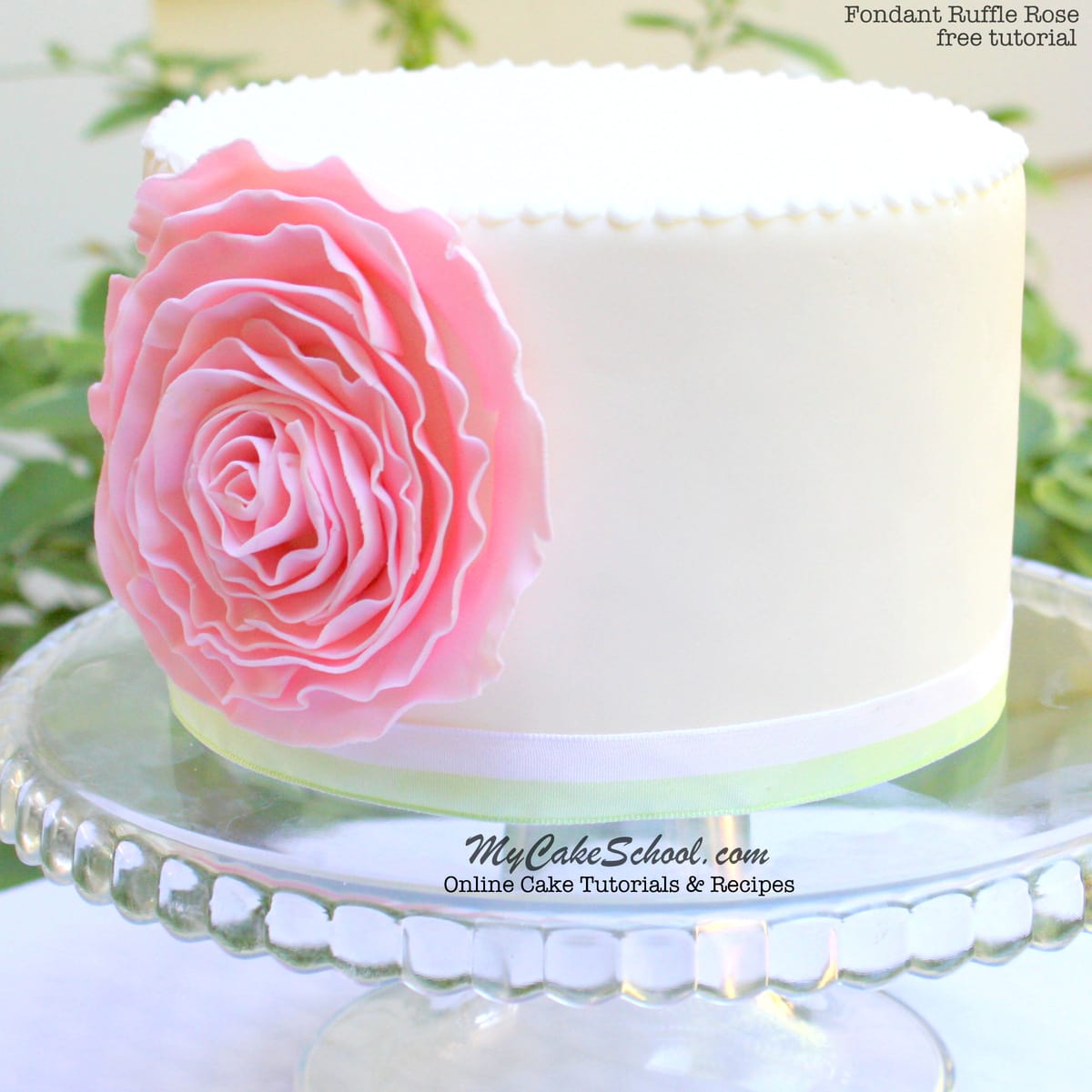 Learn how to make an elegant Fondant Ruffle Rose Cake in this free step by step cake tutorial by MyCakeSchool.com!