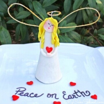 Angel Cake Topper on a white platter