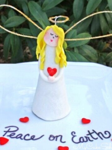 Angel Cake Topper on a white platter