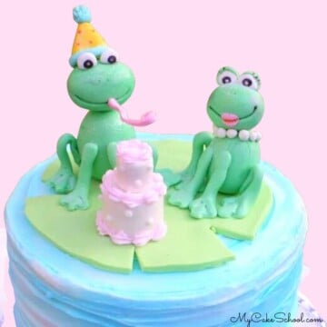 Two gum paste frogs on top of cake