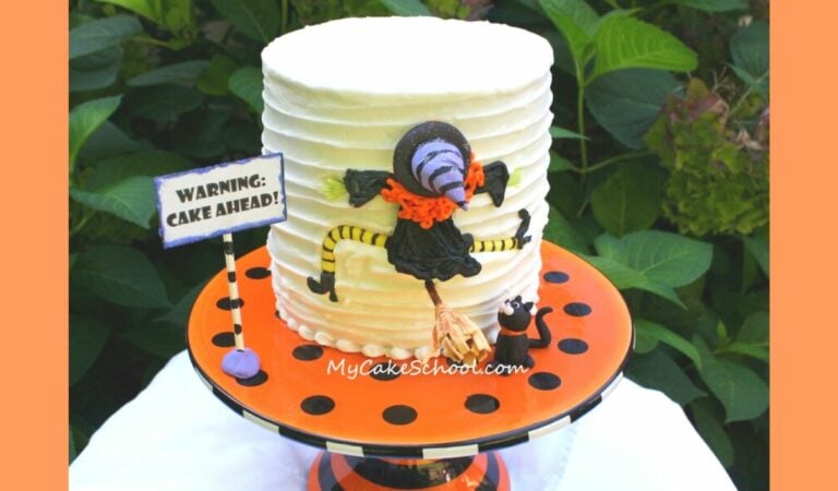 Fondant witch has crashed into cake