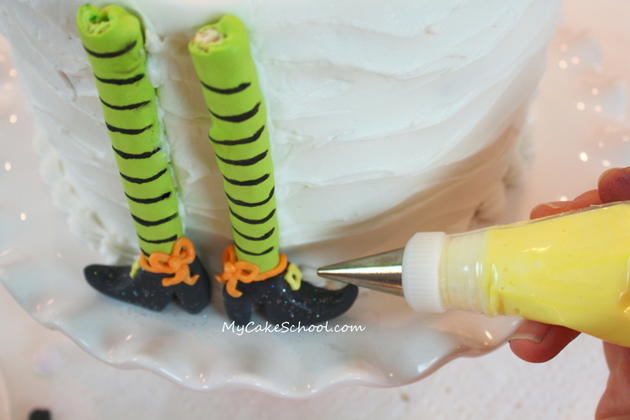 Free Tutorial for a CUTE Halloween Party Cake featuring witch legs and brooms! So fun and festive! MyCakeSchool.com 