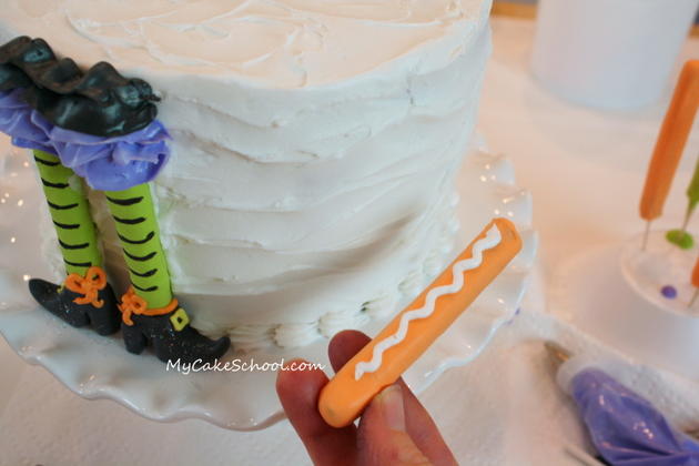 Free Tutorial for a CUTE Halloween Party Cake featuring witch legs and brooms! So fun and festive! MyCakeSchool.com 
