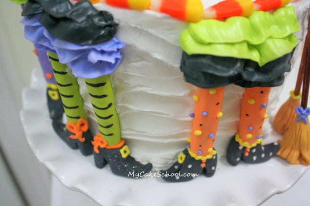 Free Tutorial for a CUTE Halloween Party Cake featuring witch legs and brooms! So fun and festive! MyCakeSchool.com 