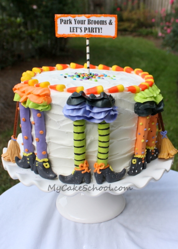 Free Tutorial for a CUTE Halloween Party Cake featuring witch legs and brooms! So fun and festive! MyCakeSchool.com 