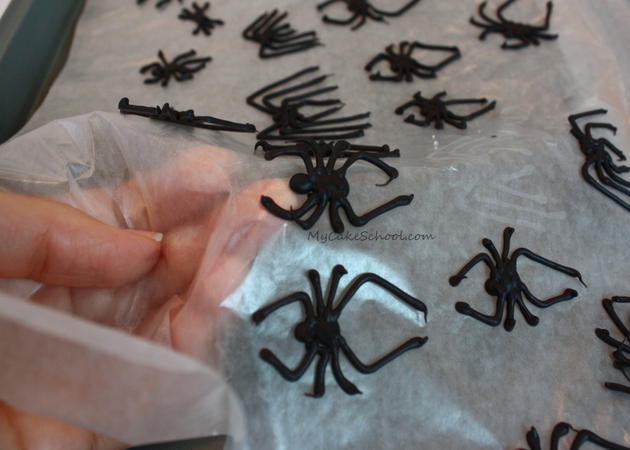 Learn how to make creepy chocolate spiders in this free Halloween cake tutorial by MyCakeSchool.com!