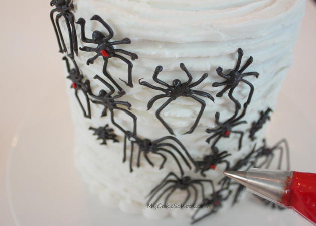 Learn how to make creepy chocolate spiders in this free Halloween cake tutorial by MyCakeSchool.com!