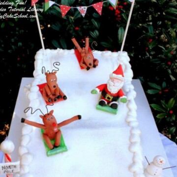 Sledding into Christmas! Learn to make Santa and reindeer toppers as well as a sledding scene in this My Cake School video tutorial!