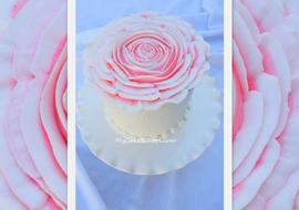 Learn to pipe an huge, elegant rose over the top of your cake in this My Cake School piping tutorial!