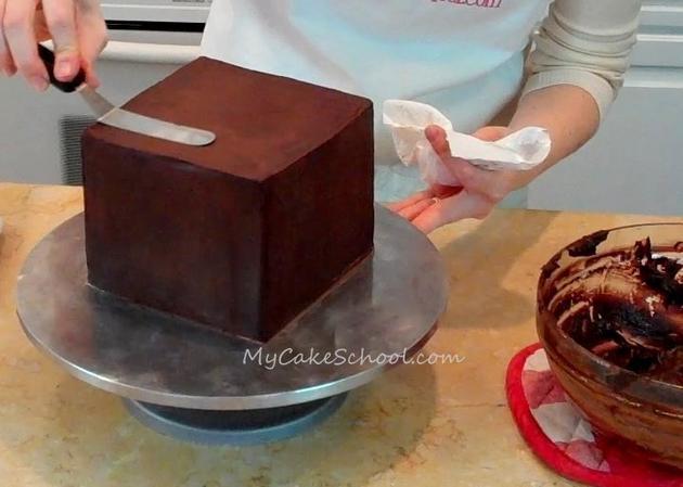 How to Ganache a square cake with straight edges! Tutorial by MyCakeSchool.com. Member Video tutorial library. MyCakeSchool.com Online Cake Decorating Classes & Recipes!