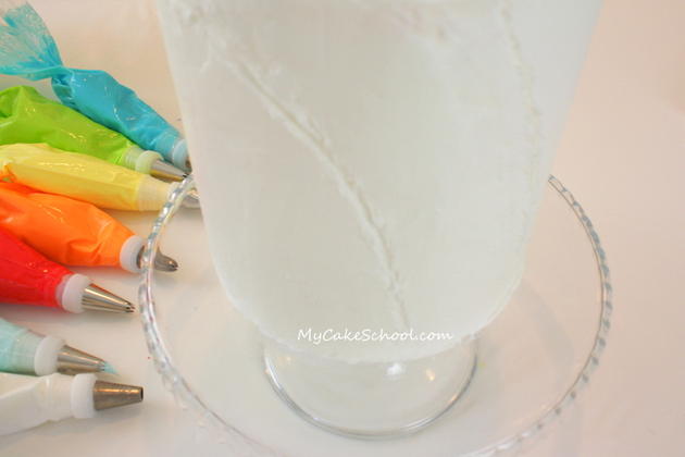 This easy and CHEERFUL Rainbow Buttercream Cake is a free cake decorating video tutorial by MyCakeSchool.com!