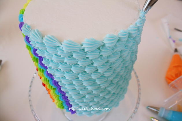 This Buttercream Rainbow Cake Tutorial is so much fun! You'll love these simple buttercream piping techniques!
