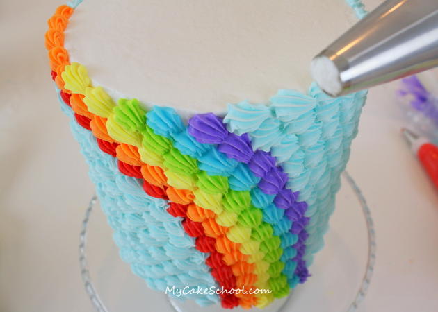 The CUTEST Rainbow Buttercream Cake Tutorial by MyCakeSchool.com! The perfect cheerful cake for birthdays and St. Patrick's Day gatherings! 