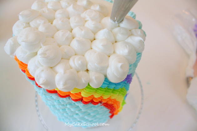 This Buttercream Rainbow Cake is adorable and so simple to make! Free step by step cake decorating tutorial by MyCakeSchool.com!
