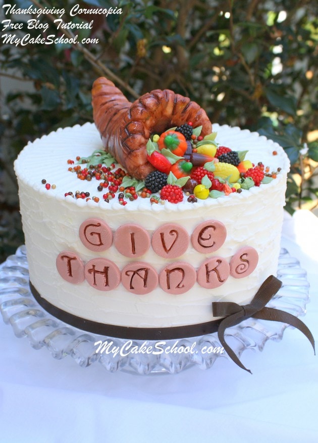 We love this simple Thanksgiving Cornucopia Cake Topper! Free cake tutorial by MyCakeSchool.com!