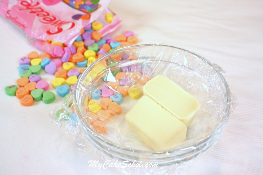 CUTE Conversation Heart Flowers for Cupcakes! Perfect for Valentine's Day! Free tutorial by My Cake School.