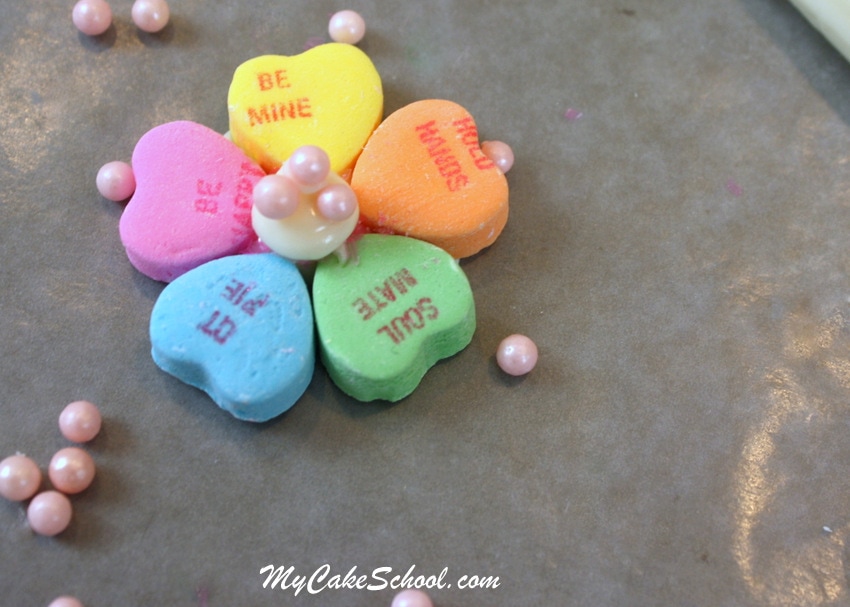 Learn how to make CUTE Conversation Heart Flowers for Cupcakes! Free Cupcake Tutorial for Valentine's Day! MyCakeSchool.com.