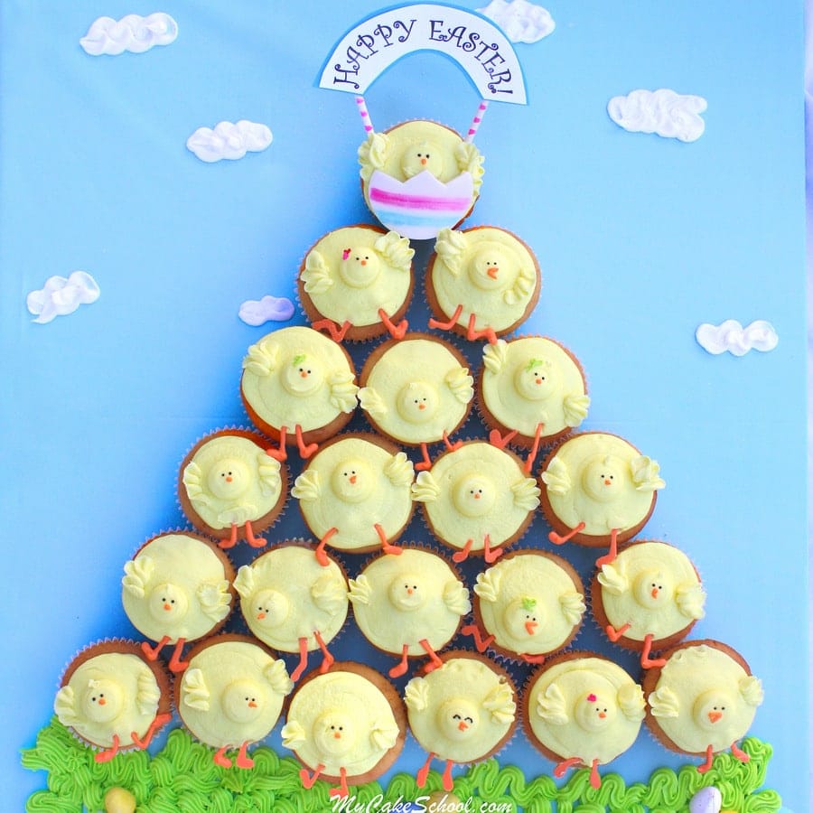 Finished Buttercream Chick Design- Cupcakes are arranged in a pyramid or triangle formation with top chick cupcake holding a Happy Easter sign.