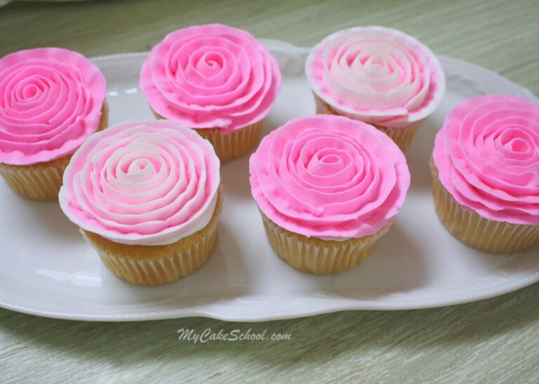 Learn how to pipe gorgeous buttercream ribbon roses onto cupcakes in this free MyCakeSchool.com cake decorating video tutorial! Perfect for all skill levels!