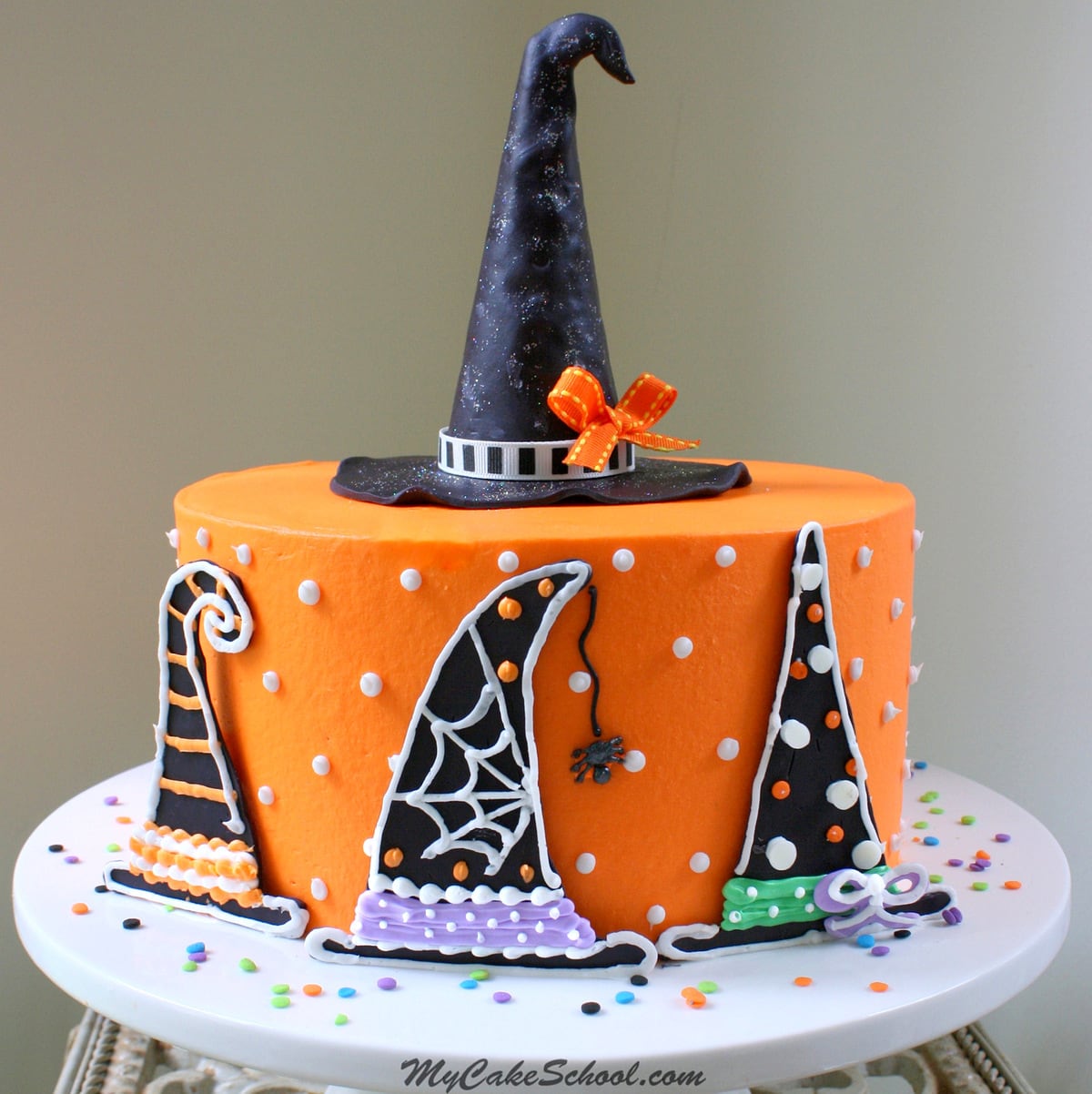 Learn to make a cute Witch Hat cake topper and easy witch hat cake designs in this free Halloween Cake Tutorial by MyCakeSchool.com!