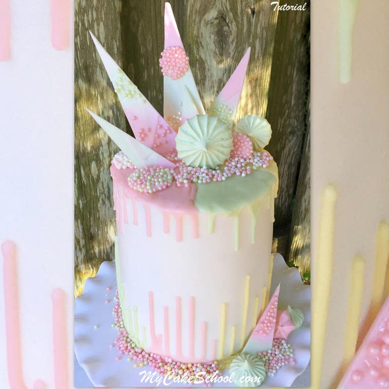 Beautiful Pastel Drip Cake decorated with meringues and chocolate shards!