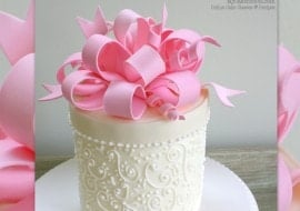 Learn to make BEAUTIFUL gum paste loopy bows in this My Cake School cake decorating video tutorial!