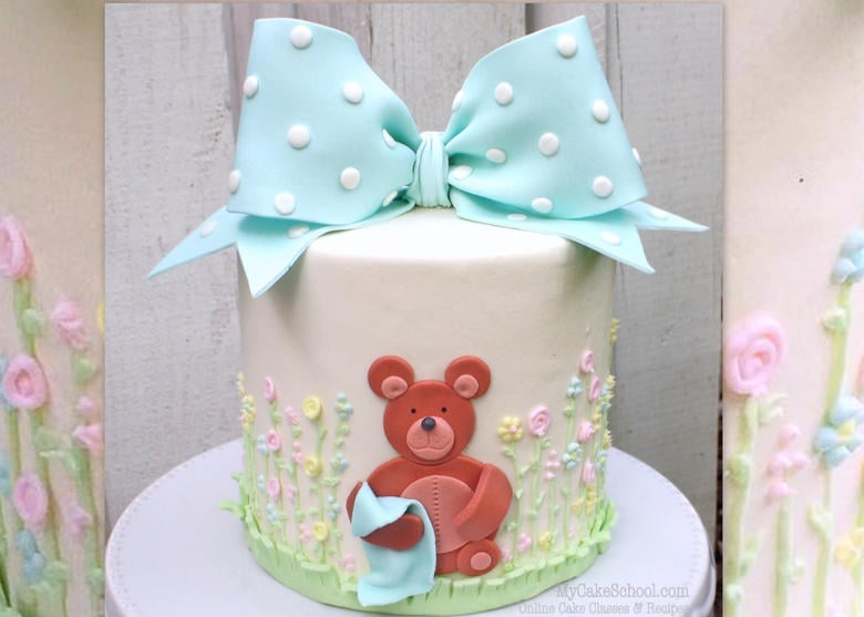 How to make an adorable classic gum paste bow and teddy bear themed cake in this My Cake School video tutorial!