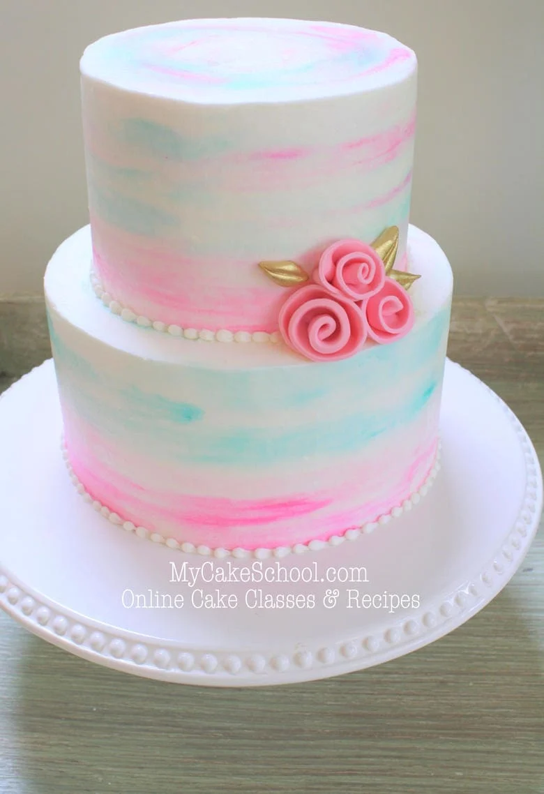 Watercolor Buttercream Cake on a white pedestal.