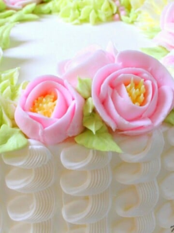 Learn how to make a gorgeous buttercream floral wreath cake in this MyCakeSchool.com cake video tutorial! MyCakeSchool.com online cake tutorials, videos, recipes, and more!
