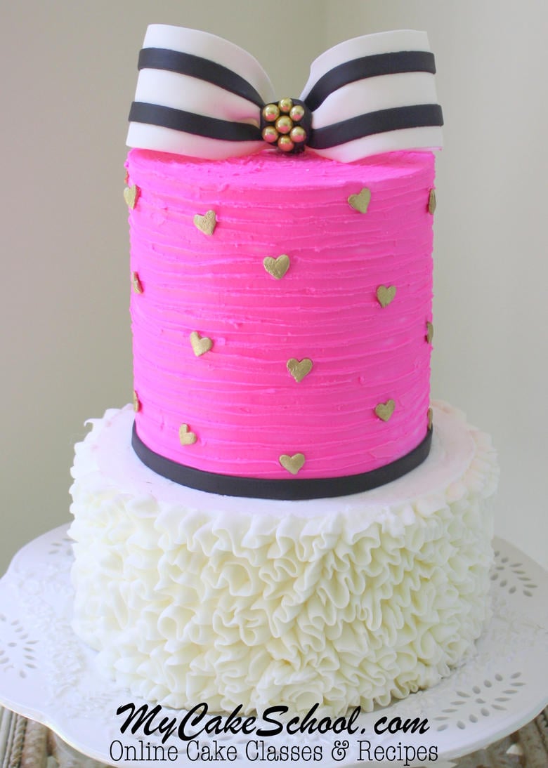 Elegant ruffled buttercream and textured buttercream cake with striped bow! A cake video tutorial from MyCakeSchool.com! Gorgeous Cake with Striped Bow and Ruffled Buttercream- A Cake decorating Video Tutorial by MyCakeSchool.com!