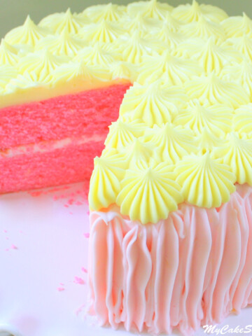 Pink Lemonade Cake on white pedestal.