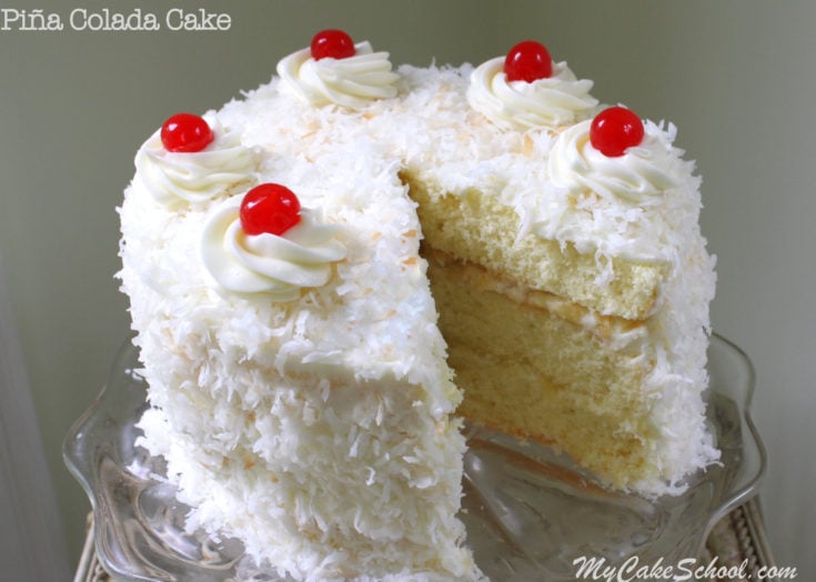 The BEST Piña Colada Cake Recipe from Scratch! Moist coconut cake layers with crushed pineapple filling, Piña Colada Cream Cheese Frosting, and a hint of rum. MyCakeSchool.com.