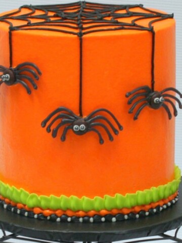 The Perfect Halloween Party Cake! In this free cake video, learn to create fun & creepy Chocolate Spiders! Tutorial by MyCakeSchool.com.