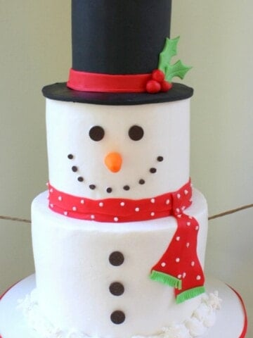 Sweet Snowman Cake! A cake decorating video tutorial by MyCakeSchool.com.