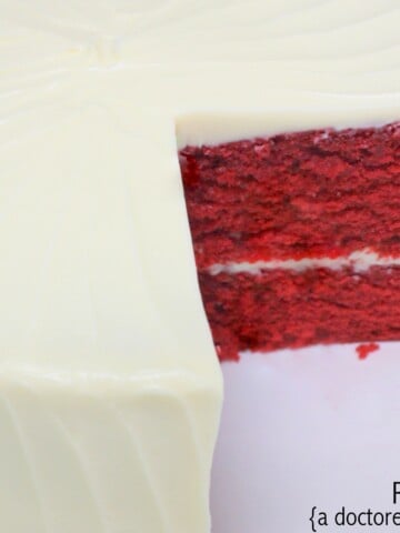 The BEST doctored cake mix Red Velvet Cake recipe! Super moist, delicious, and fantastic with Cream Cheese Frosting! MyCakeSchool.com.