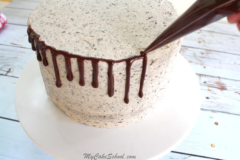 The BEST Oreo Cake from scratch! Moist chocolate cake layers with Oreo Buttercream and ganache! MyCakeSchool.com.