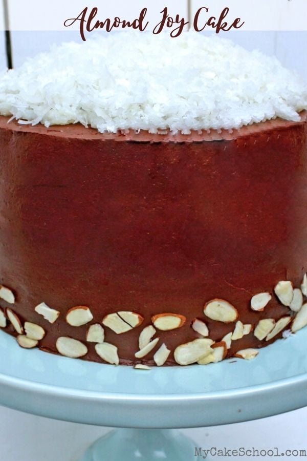 This decadent Almond Joy Cake consists of rich chocolate cake, a thick coconut filling, ganache frosting, and almonds! Omit the almonds and you have a Mounds cake! So good! Amazing Almond Joy (or Mounds) Cake from Scratch!