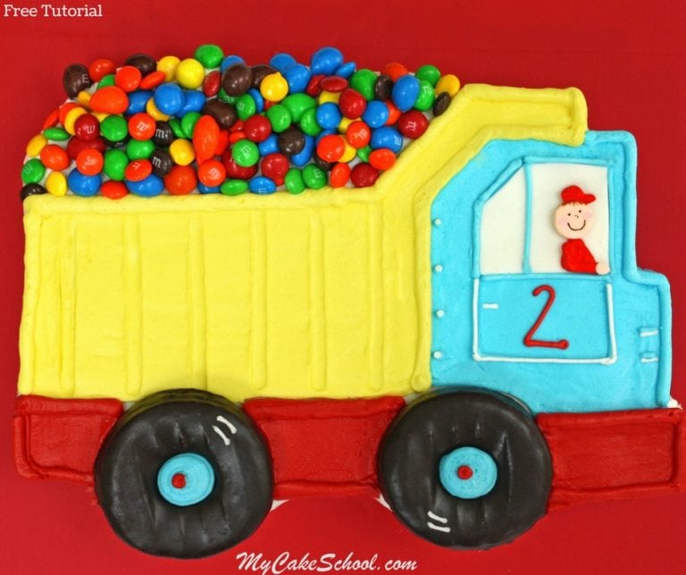 Dump truck sheet cake on a cake platter.