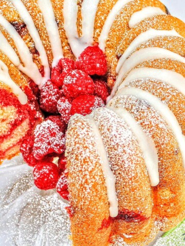 Moist and flavorful Lemon Raspberry Swirl Pound Cake Recipe by MyCakeSchool.com!