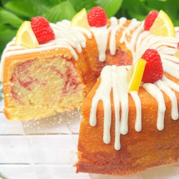 Lemon Raspberry Cake on a cake pedestal.