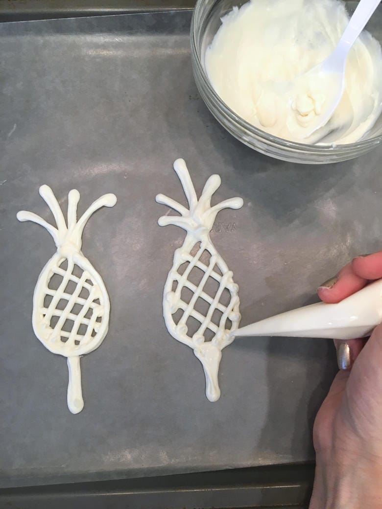 Super cute and simple Pineapple Cake Toppers made from melted chocolate candy coating! We used this for our homemade pineapple cake! MyCakeSchool.com.