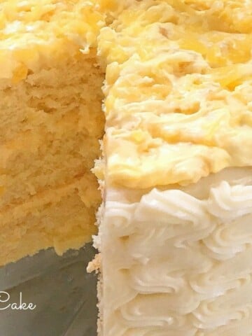 AMAZING Pineapple Cake! Moist yellow cake layers with pineapple and cream filling and cream cheese frosting! Recipe by MyCakeSchool.com!