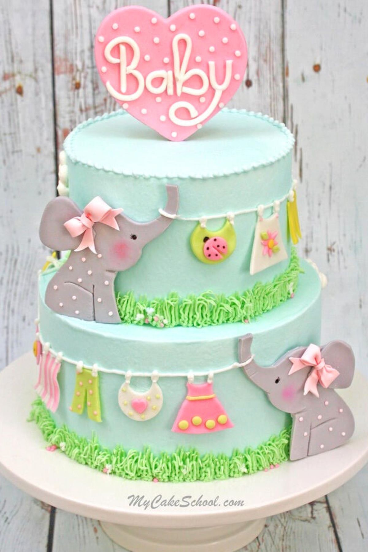 Elephant Baby Shower Cake on white pedestal.