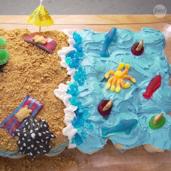 CUTE Beach Cupcake Cake Tutorial by the Food Network as featured in MyCakeSchool.com's roundup of favorite Cupcake Cake designs)
