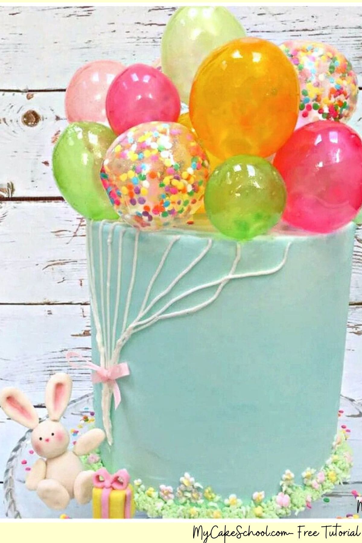 Gelatin Balloons Cake on a cake pedestal.