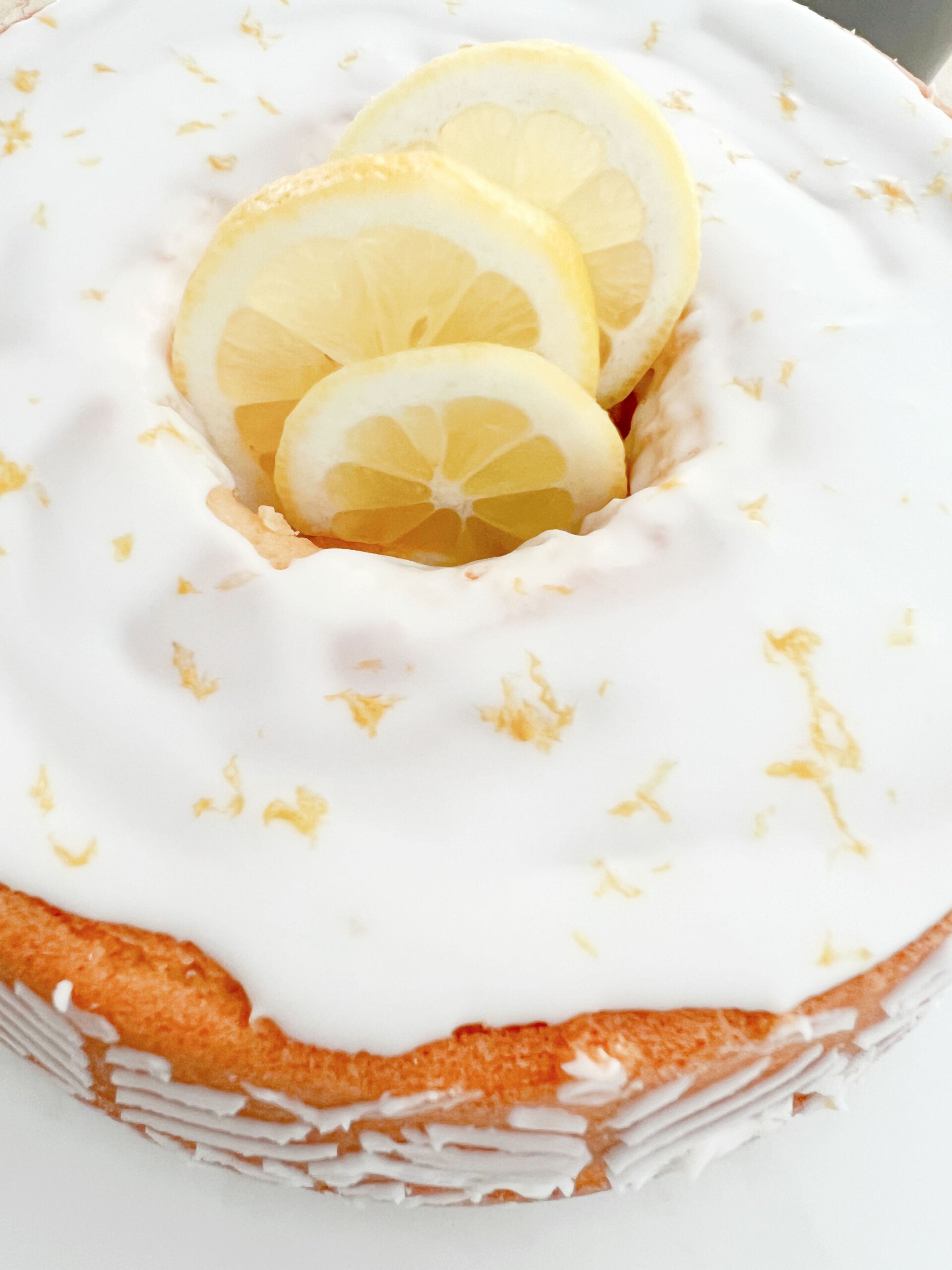 Top view of the Lemon Pound Cake, with lemon slices in the center.