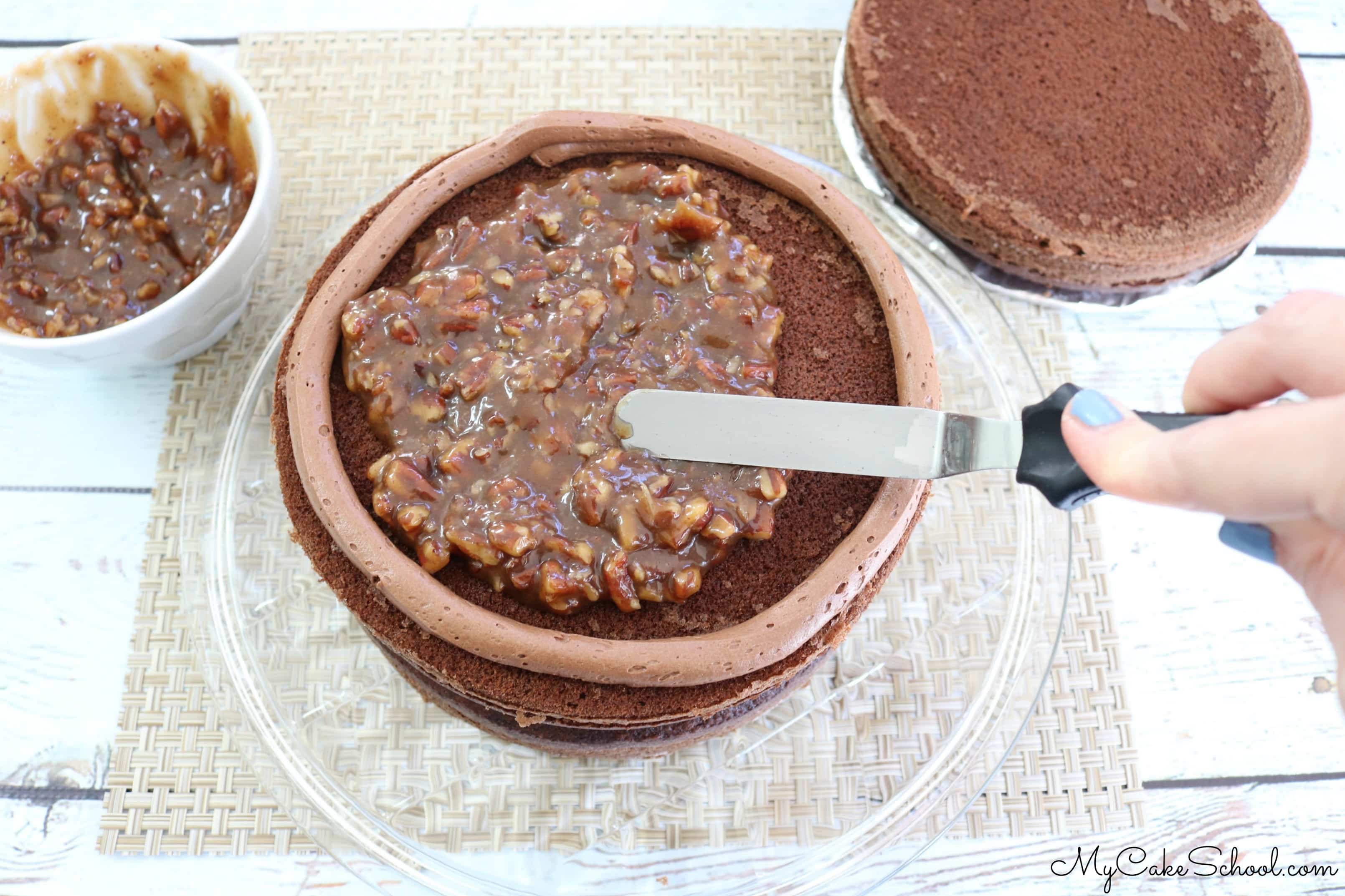 We LOVE this decadent and flavorful Chocolate Pecan Pie Cake Recipe
