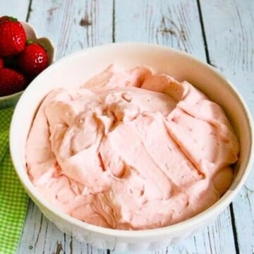 White Bowl filled with pink Strawberry Whipped Cream Cheese filling.